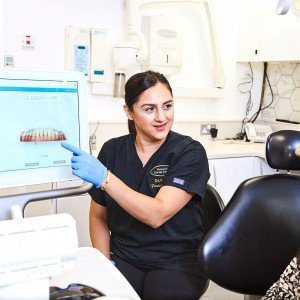 dentist explaining dental prints to patient